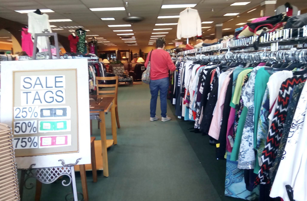 Boutique clothing rack featuring sustainable pre-owned fashion