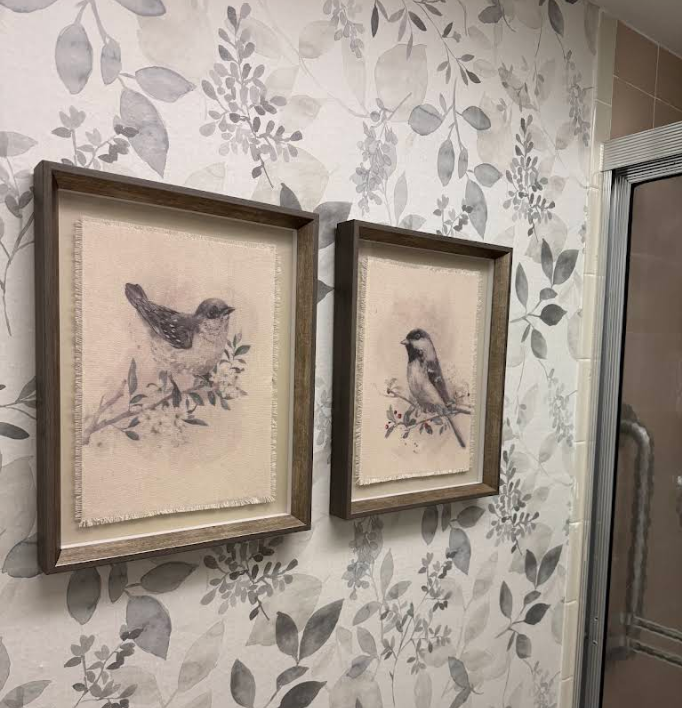 Original framed artwork, mirrors, and designer lighting